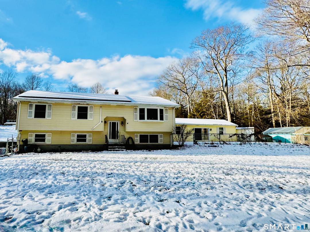 Welcome to this well maintained raised ranch, privately set back on a wooded lot in Ledyard, offering a peaceful and private setting with a thoughtfully designed, flexible layout.