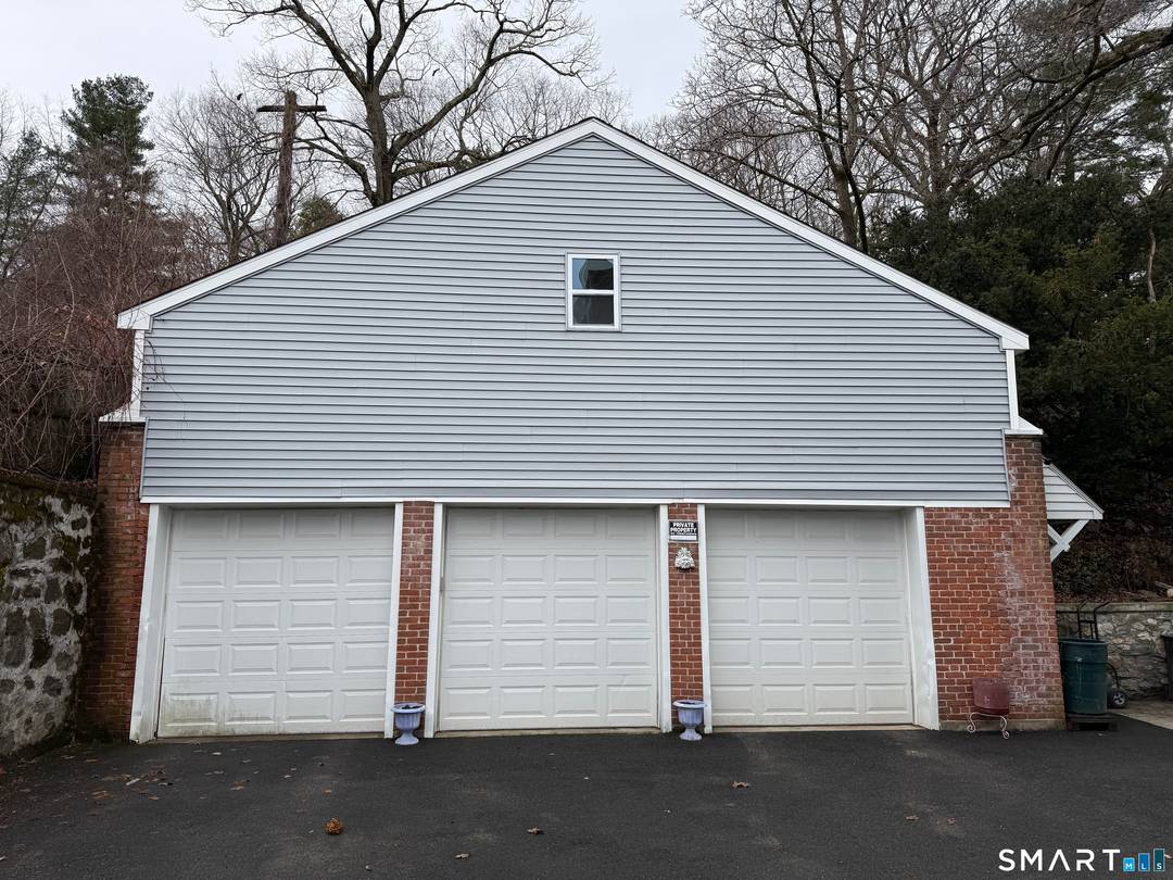 Investor Alert ! Exceptional income producing opportunity with this well maintained three family property, offering additional potential for a studio apartment above the three car garage.