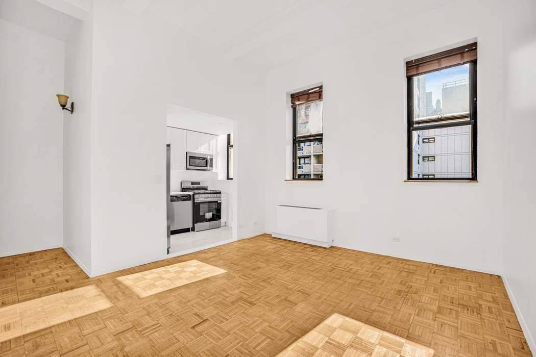 Loft Style Pre War Condo Across from Central Park Apartment 5L at 1255 Fifth Avenue is a rare pre war condominium offering dramatic 12 foot beam ceilings that create a ...