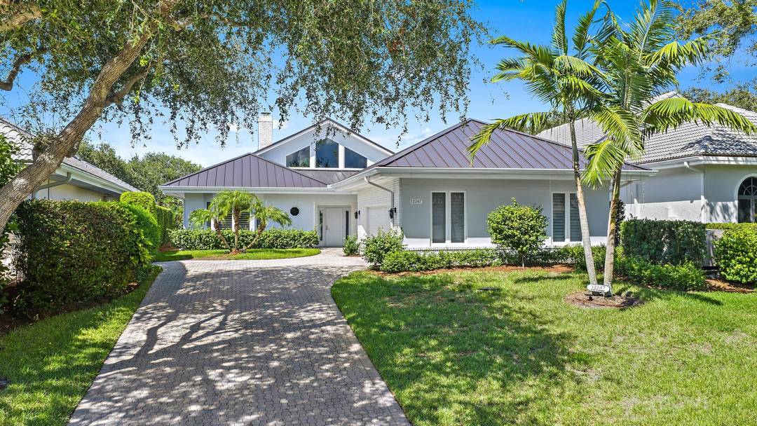 Nestled in the prestigious community of Jupiter Hills Village, is a stunning 4 bedroom, 3.