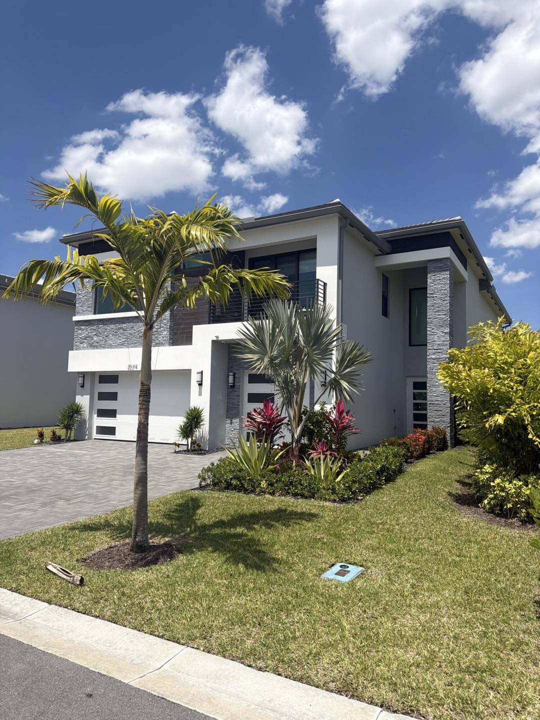 Set on a rare oversized corner lot with an extended easement, this lakefront estate offers a level of privacy and open space that's hard to find within Lotus Palm in ...