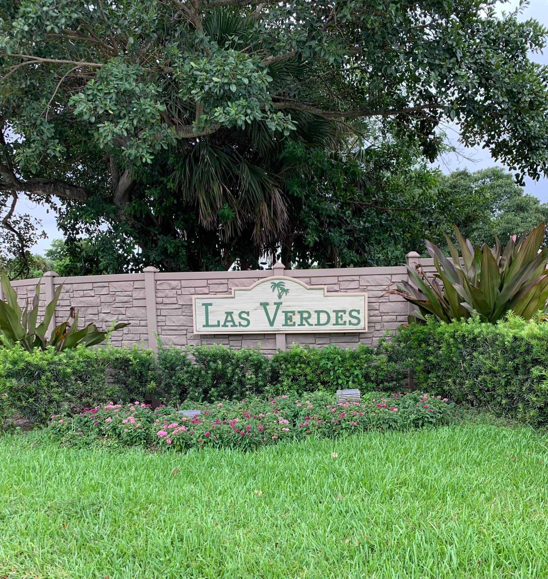 Beautiful 2 bedroom 2 bath 1st floor unit with screened in porch, roll down shutters, stacked washer dryer, tile in main living area and carpet in the bedrooms.