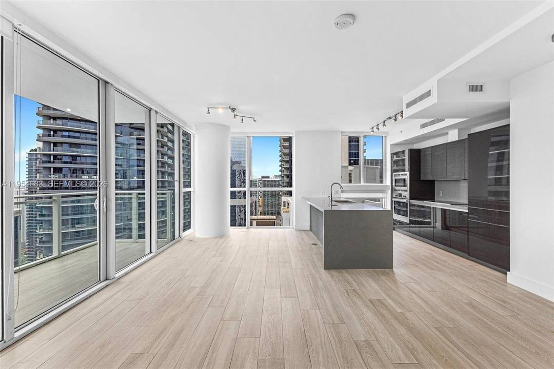Experience sweeping city views and spectacular sunsets from this high floor corner residence at The Bond at Brickell.