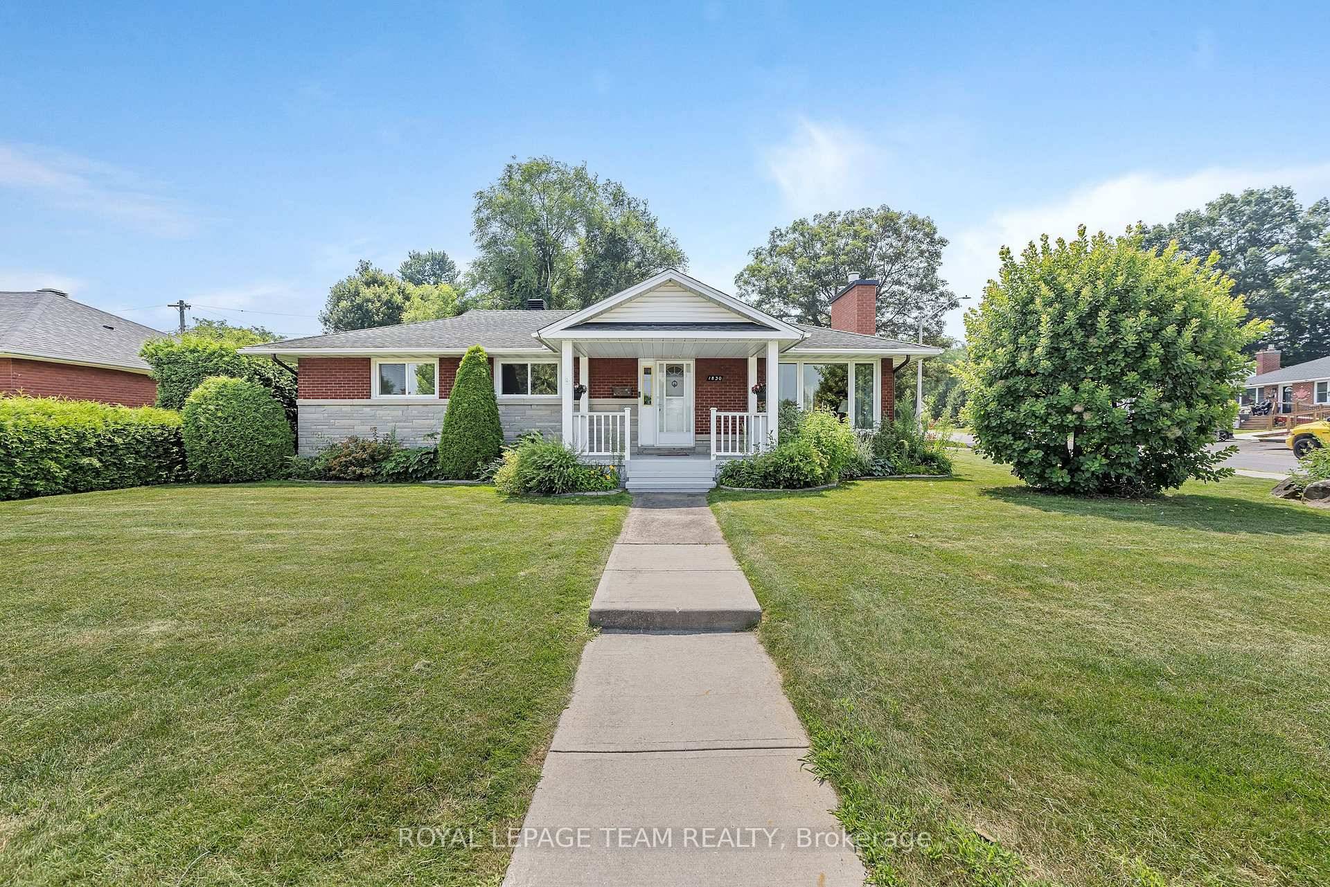 Pretty as a picture ! Solidly built bungalow on generous corner lot w spacious 2 car detached garage.