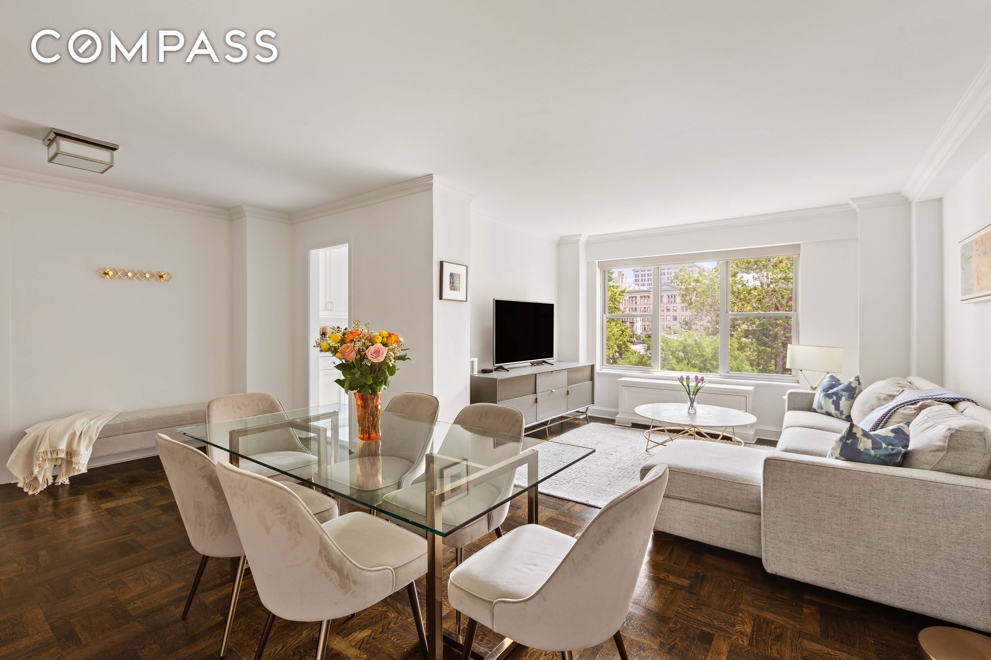Move right into this beautiful, very sunny, large one bedroom with renovated kitchen and bathroom in an incredible full service, amenity filled building seconds from Washington Square Park.