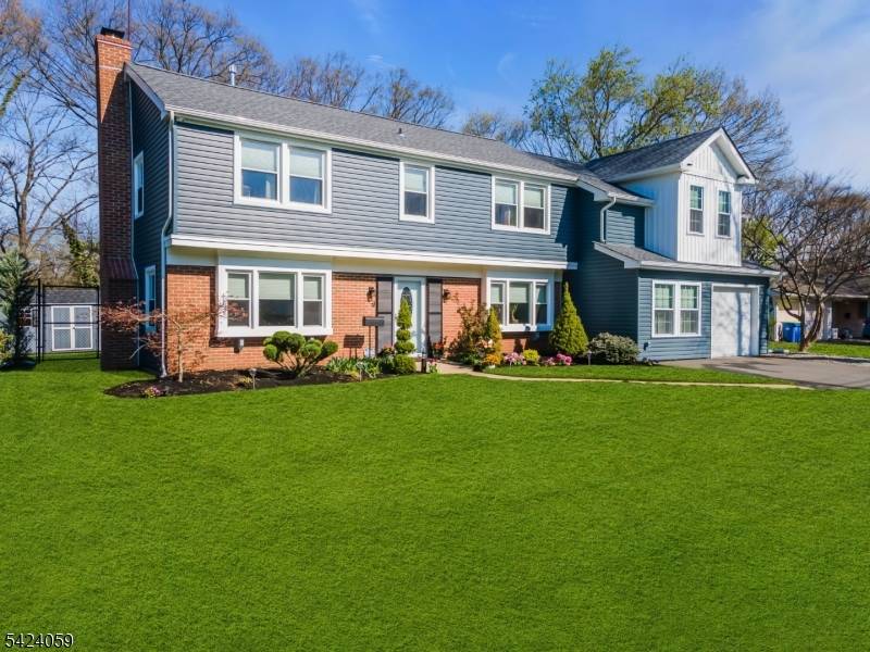 STUNNING fully renovated Colonial with 5 Bedrooms, 3 full baths, office including 1st floor bedroom !