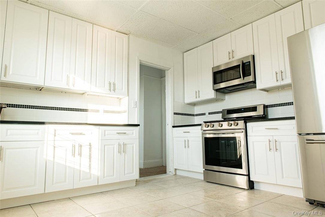 Large 4 Bedrooms apartment in perfect location, New Eat In Kitchen with Stainless steel appliances, large deck for family use.