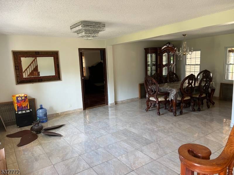 Spacious and well maintained home in the heart of Dumont offering 5 bedrooms and 4 full bathrooms.