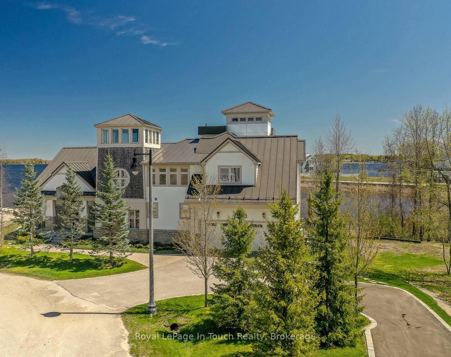 Waterfront Living at Its Finest Stunning Contemporary Home with Attached Guest House.