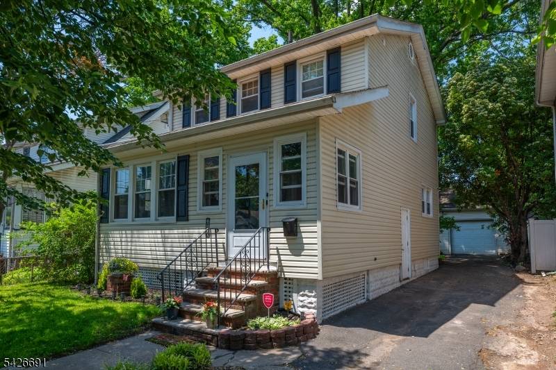 Beautifully maintained side hall colonial w enclosed front porch entrance vestibule perfect for sitting, relaxing and watching the world go by.