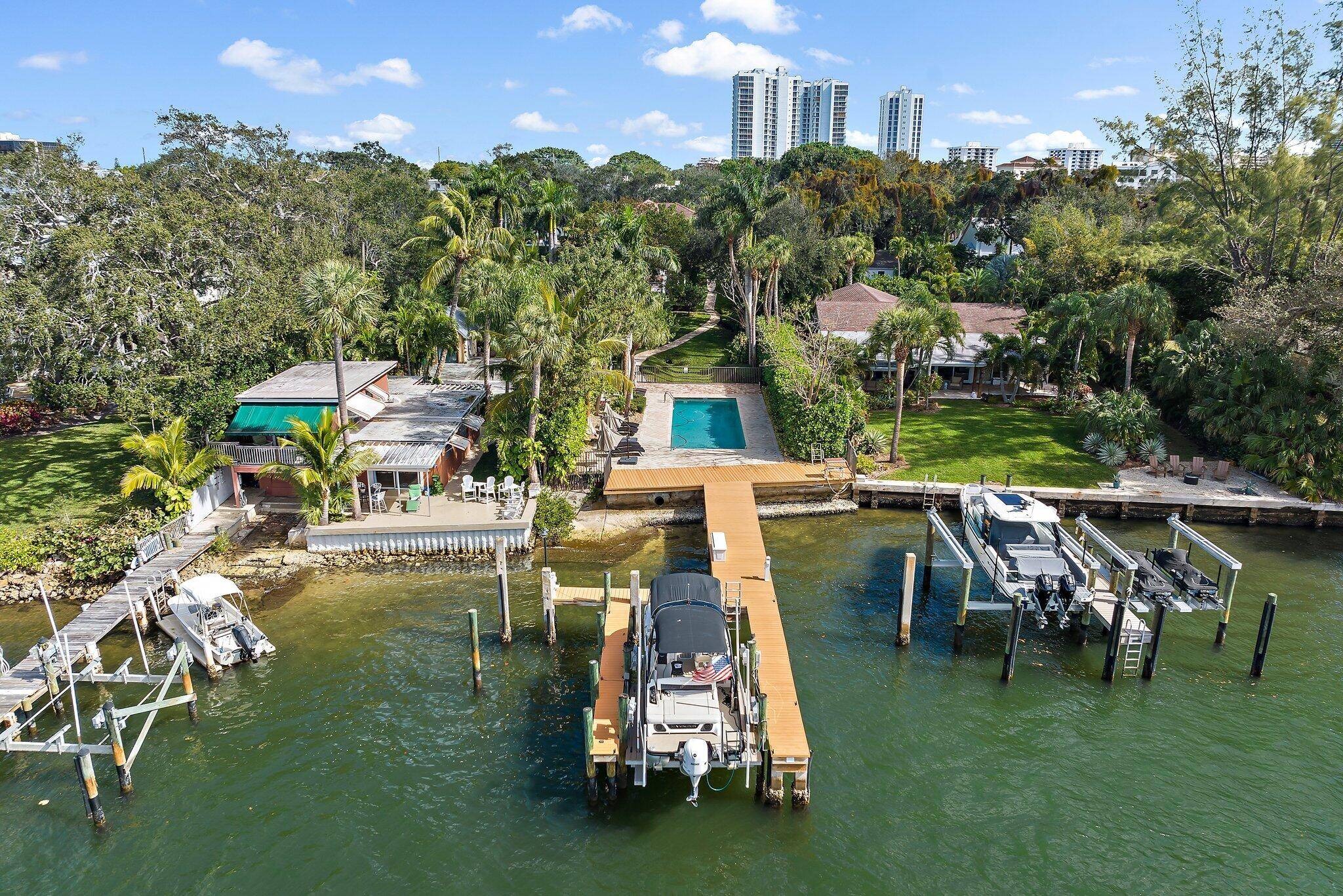 Nestled in a private enclave, this waterfront townhome is luxury living at its finest.