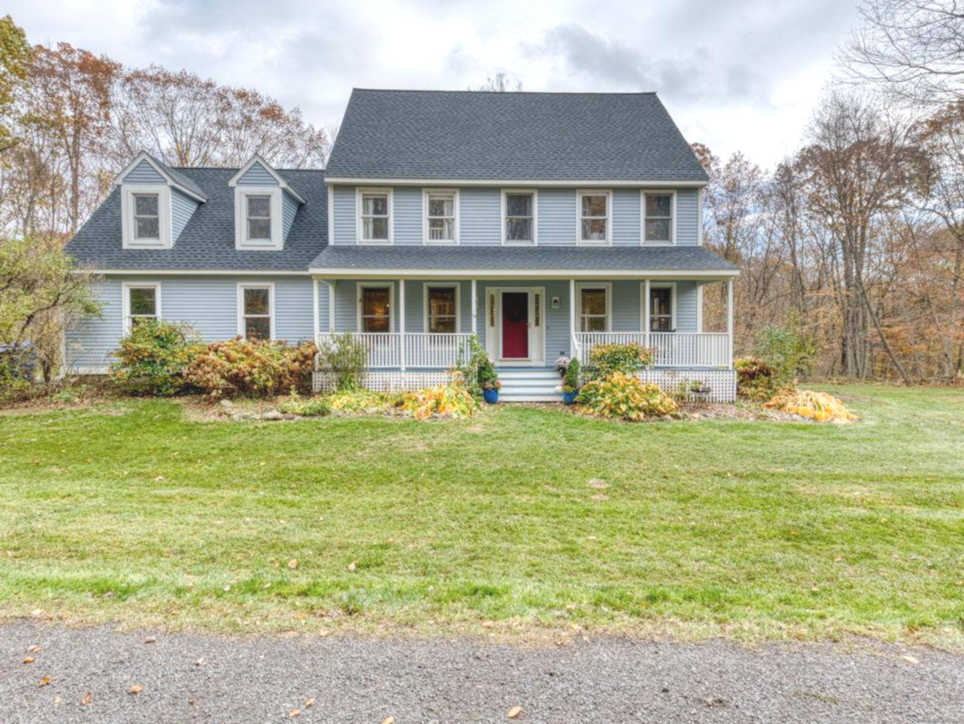 Private yet conveniently located, this lovely colonial style home sits on its own peaceful 7.