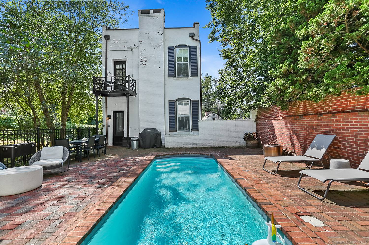 Step into a one of a kind opportunity at 35 Rose Hill Road a charming white brick antique originally built in 1912 as the Southport Telephone Exchange.