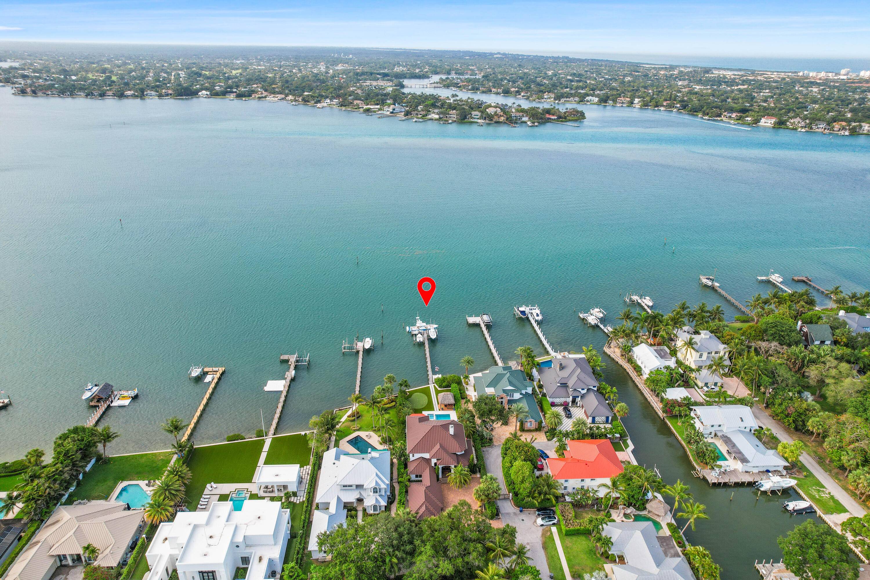 A unique enclave positioned with sweeping views of the serene blue waters of the Loxahatchee River.