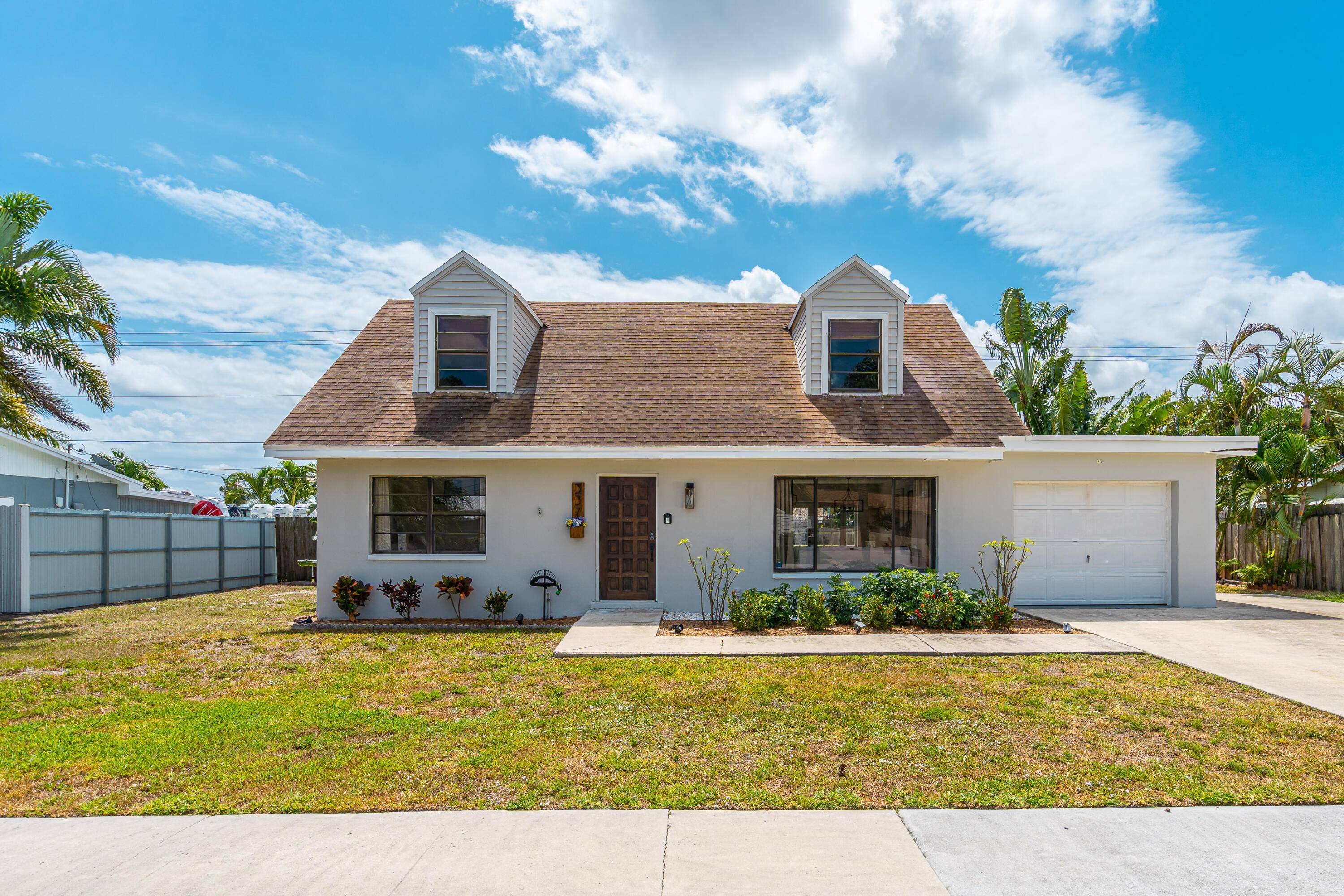 Experience the perfect blend of style, comfort, and convenience in this stunning two story home located just minutes from West Palm Beach !