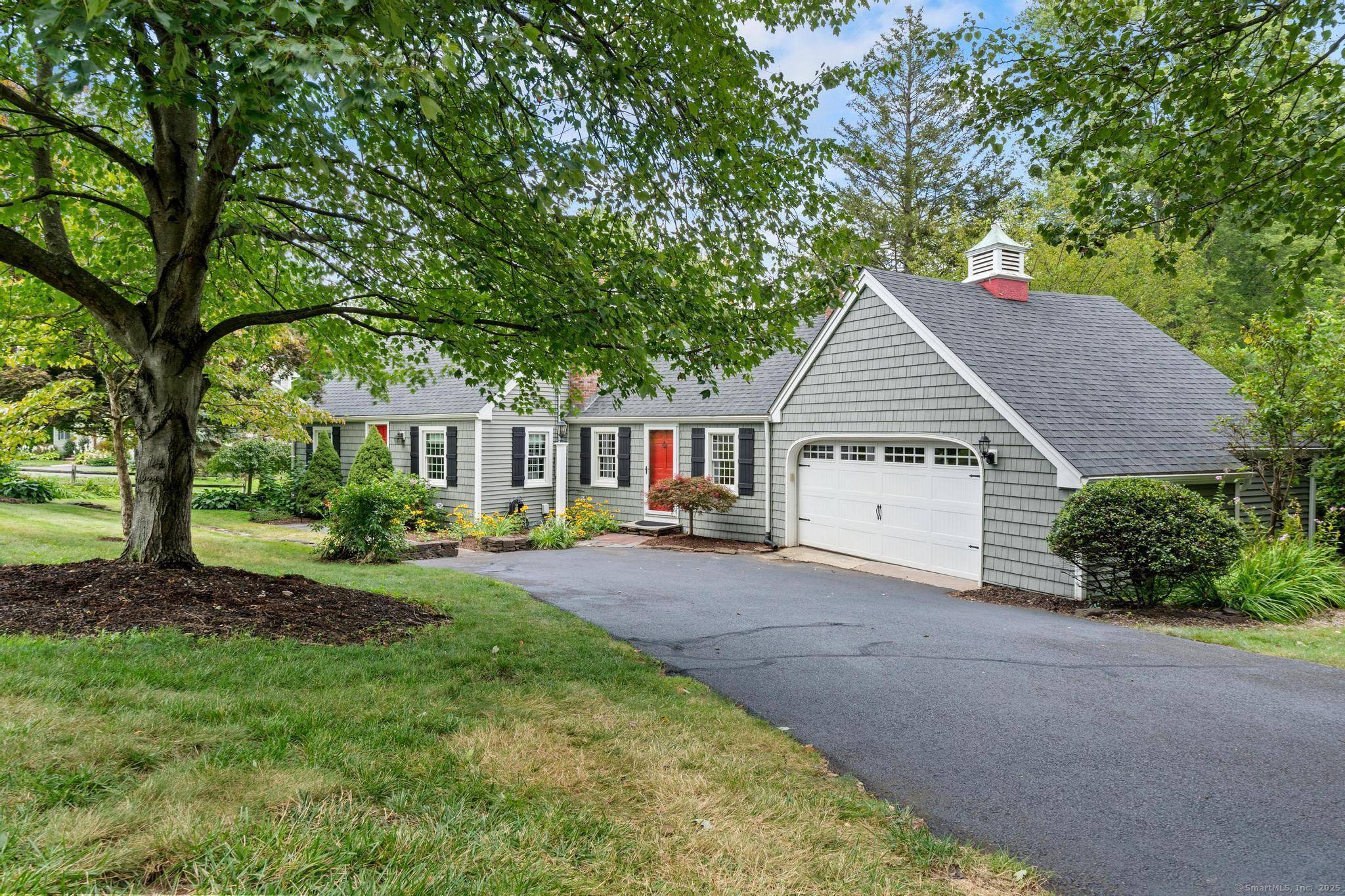 Located on one of Suffield's most desirable streets, just steps from Main Street and the Suffield Country Club, this classic New England Cape blends timeless character with modern comfort.
