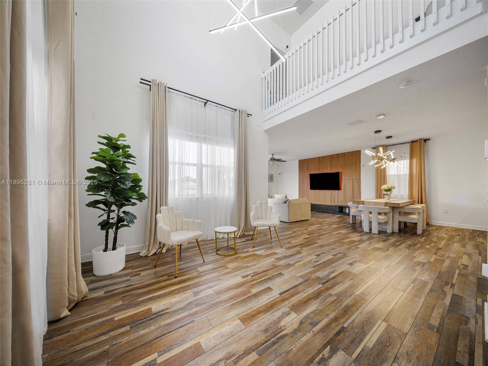 Lakefront modern living awaits in this stunning residence featuring two additional rooms and bathrooms from a garage conversion, perfect for in laws or guests.