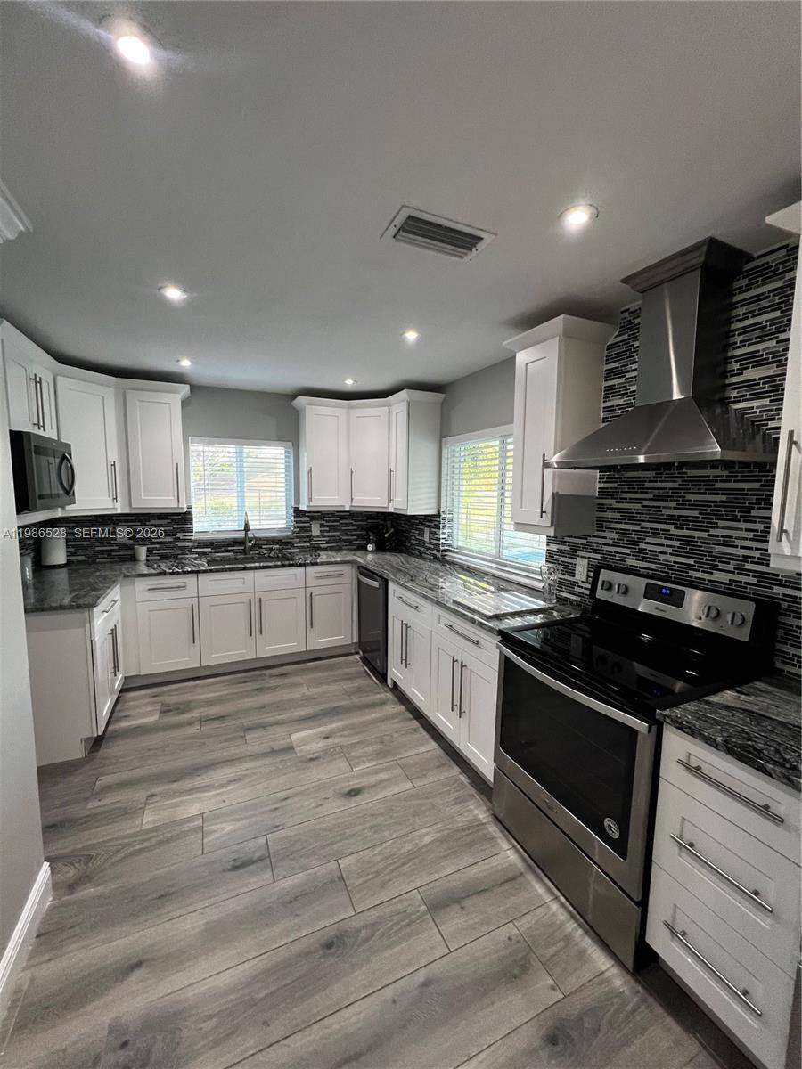 Beautifully Remodeled 3 Bed 2 Bath 2 Car Garage home with an additional room !