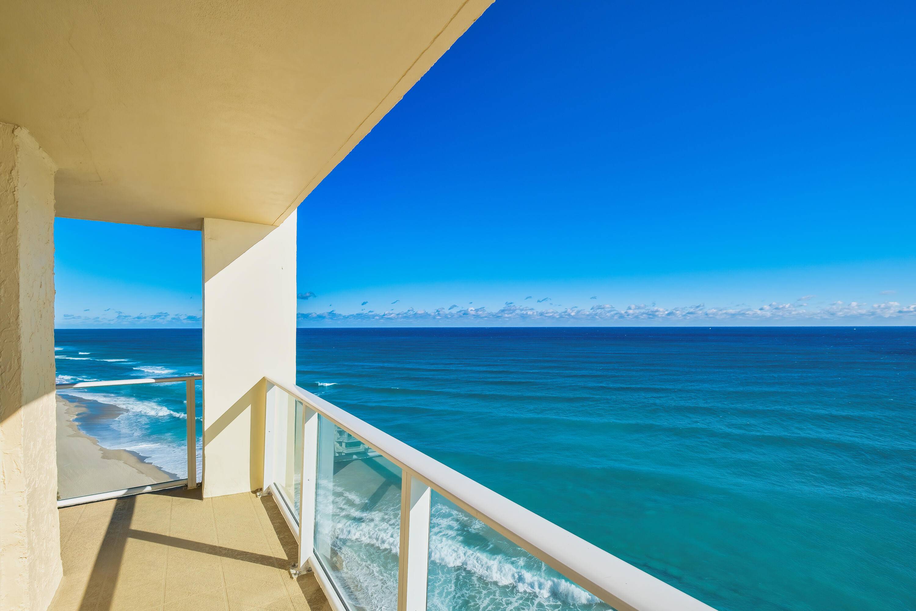 Experience coastal living at its finest in this stunning northeast corner residence with breathtaking, uninterrupted ocean views from every room including the living room, dining room, kitchen, and both bedrooms.