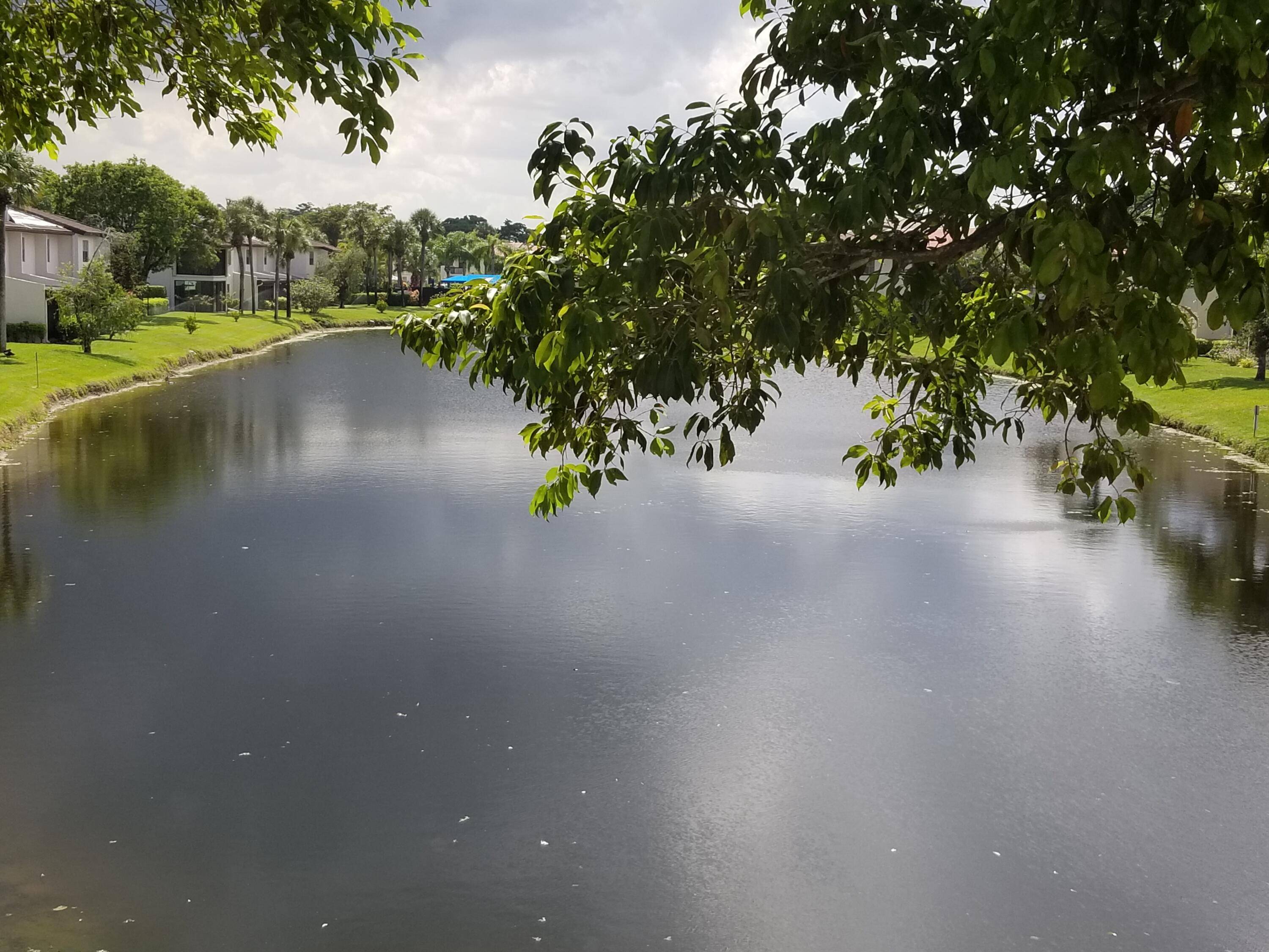 Gated community. Beautiful second floor private condo with stunning lake and fountain views in Boca Lago Country Club.