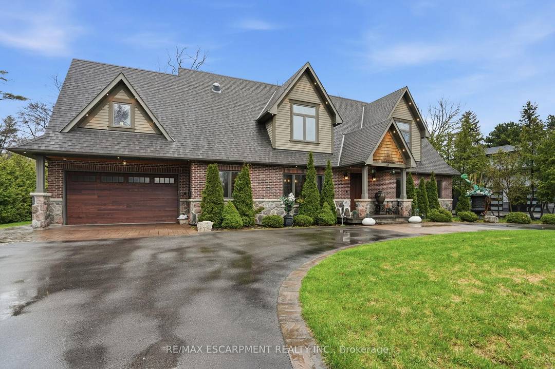 Timeless design and exceptional functionality define this beautifully finished home set on a landscaped lot with a circular driveway and strong curb appeal.
