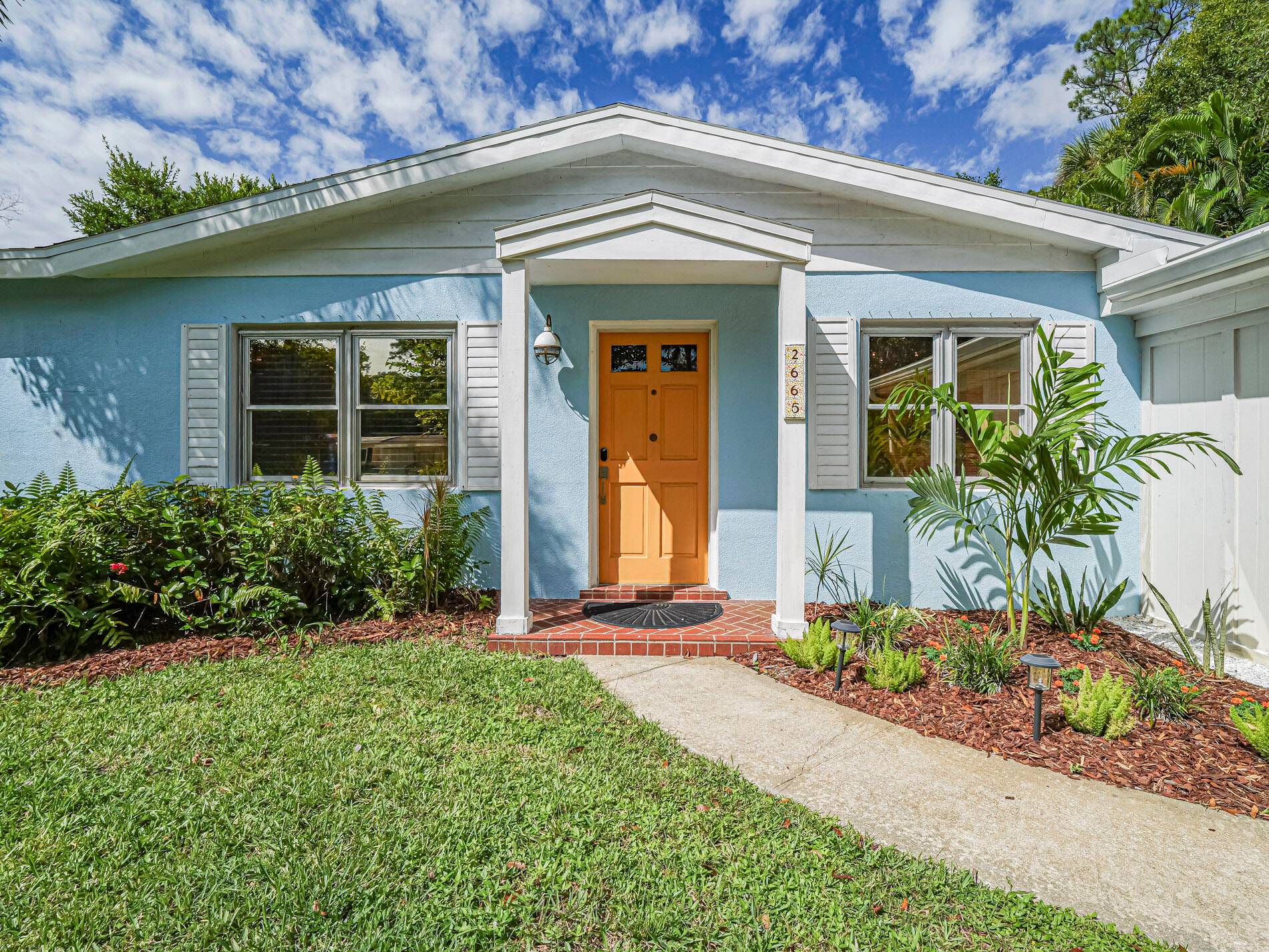 This delightful, fully furnished home is brimming with classic Old Florida charm.