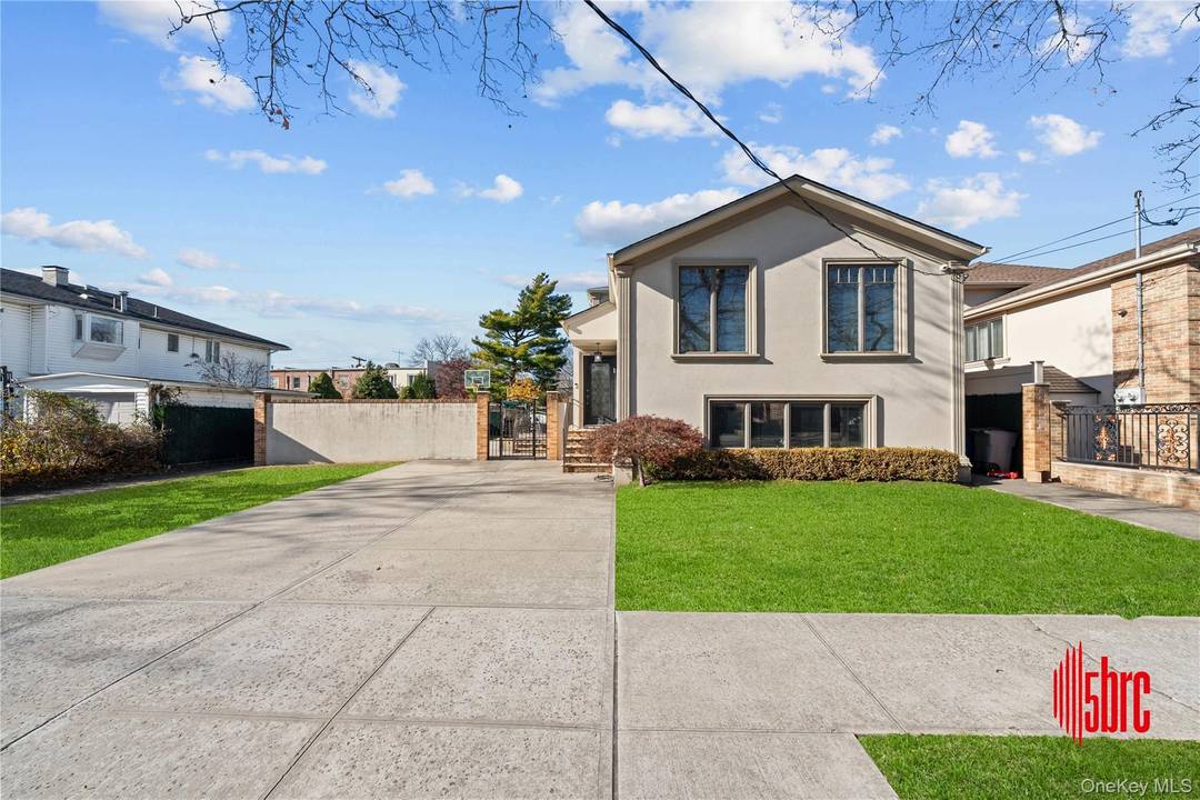 Welcome to this beautifully renovated two family home in the heart of Mill Basin, perfectly situated on an expansive 56 ft x 100 ft lot.