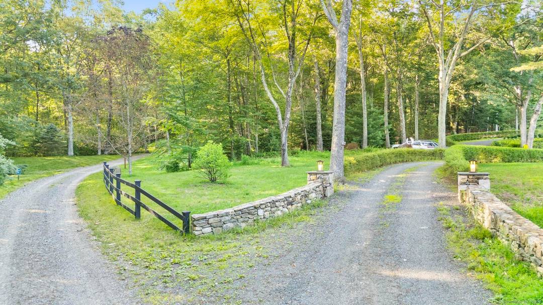 Tucked into the hills of Roxbury, this 4, 000 sq ft Mid Century Modern home is a private architectural retreat surrounded by wildflower clearings, forest, and dramatic granite outcroppings.