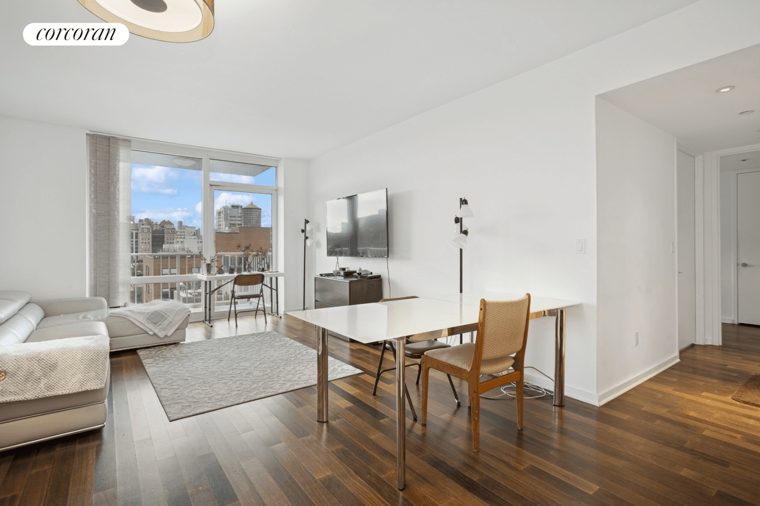 This sun drenched, two bedroom, two bathroom corner residence is a serene and private retreat for those who appreciate natural light and refined design.