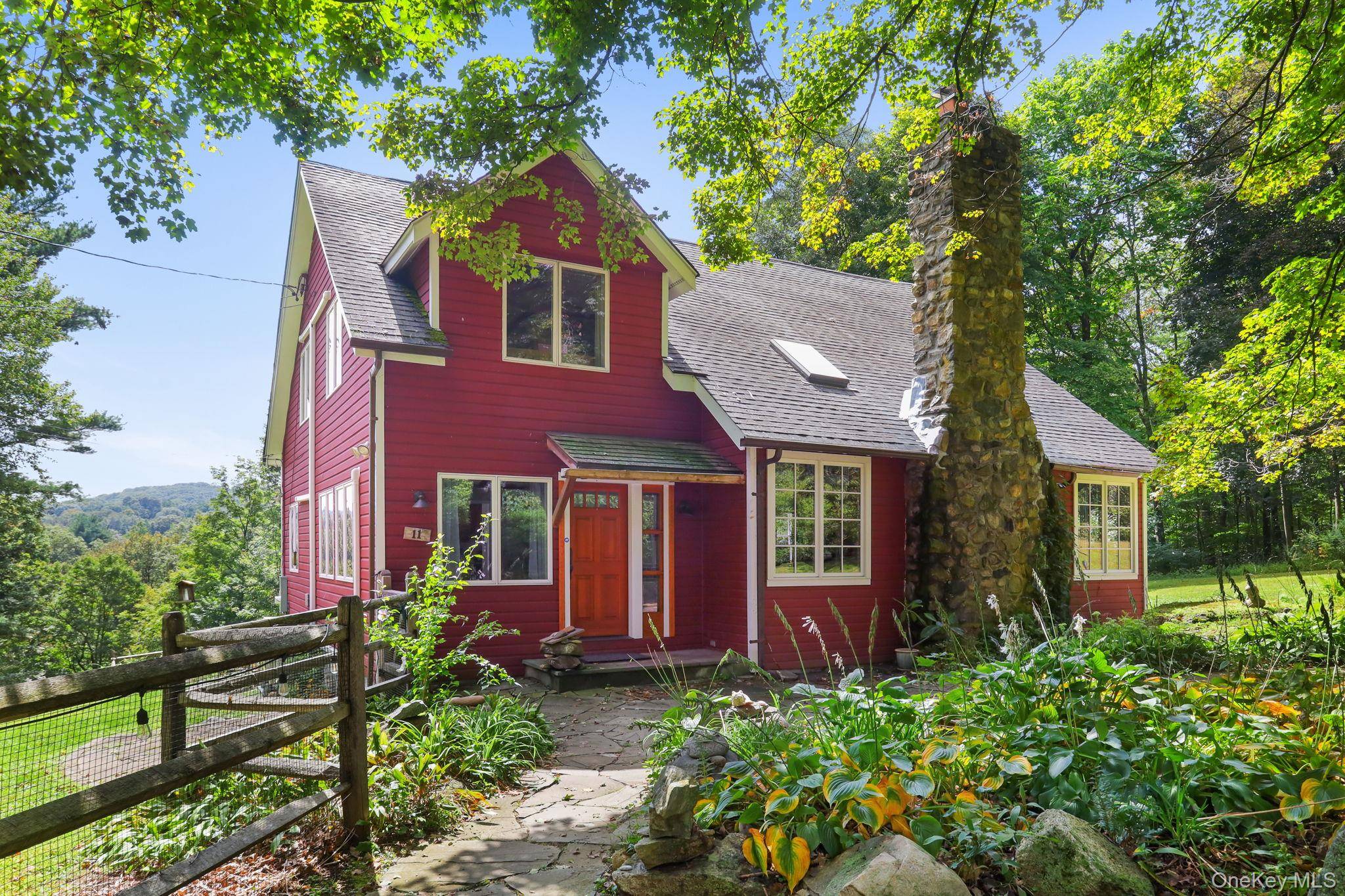 A magical retreat surrounded by 14 acres of protected, forever green land, with mature pine forests on two sides and a year round flowing trout stream with a deep swimming ...