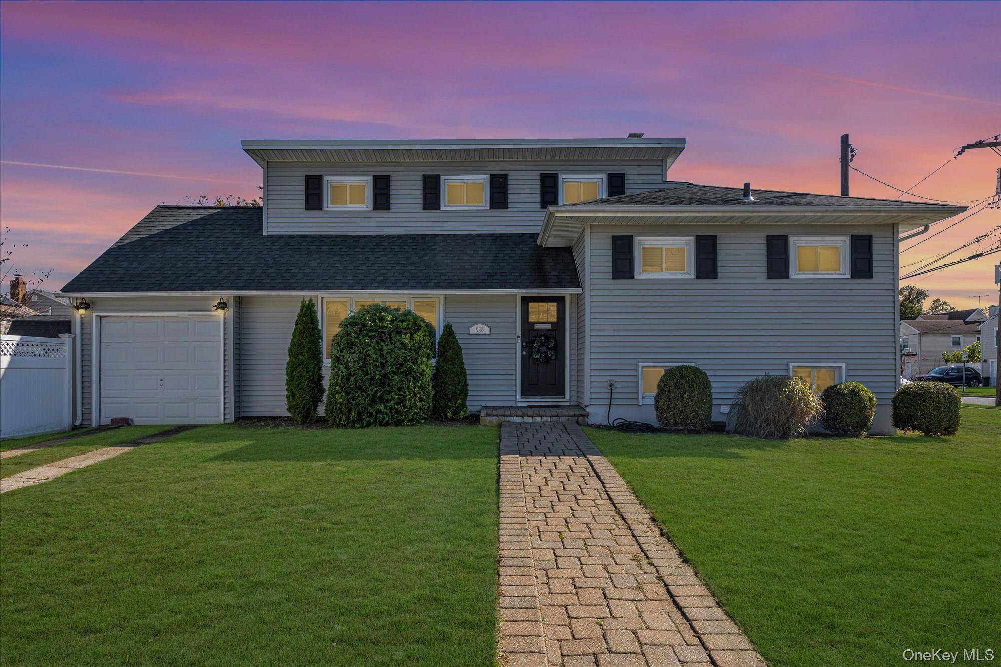 Welcome to 528 Carpenter Avenue, nestled in the desirable Estates Section of Oceanside within the Oceanside School District.