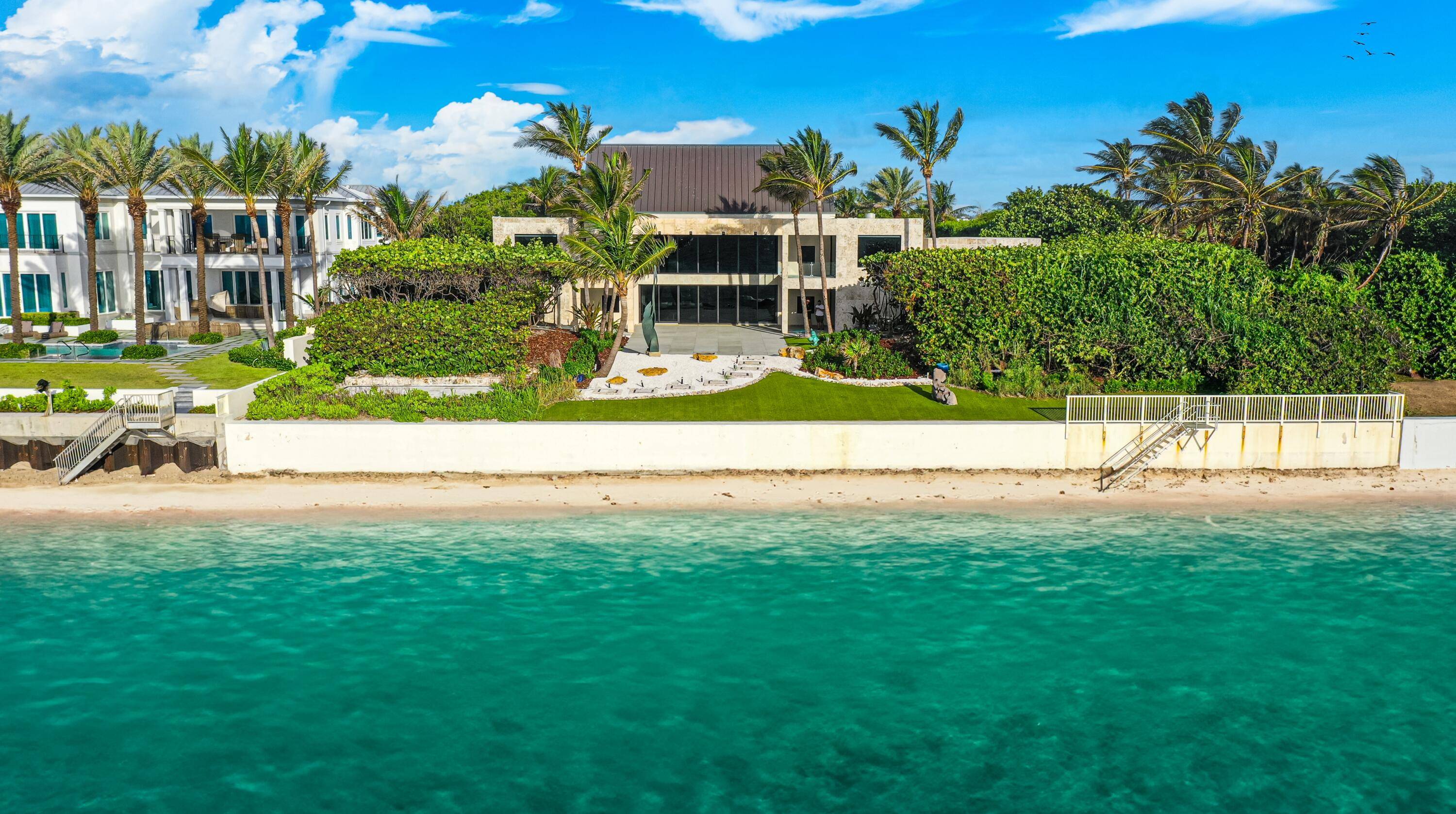 With renovations now complete, this high elevation, coquina clad estate presides over 150 feet both on the ocean and Intracoastal.