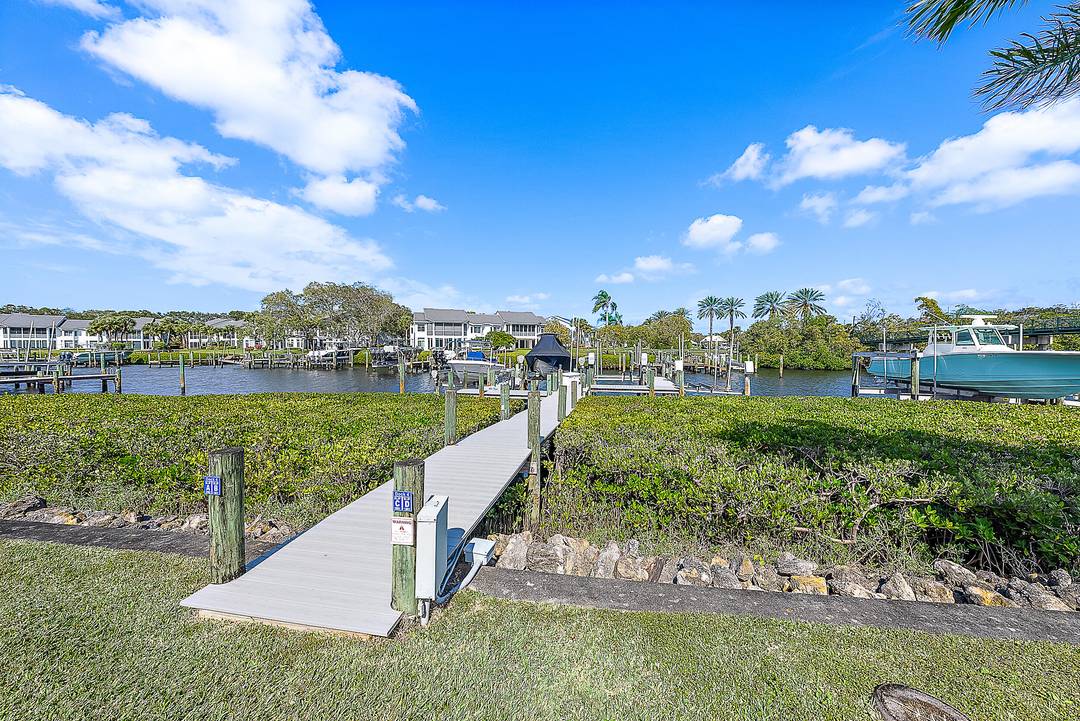 RENOVATED COMPLETE EARLY 2026 Experience the epitome of waterfront luxury in this first floor renovated Harbor Home on Captains Way, nestled in the prestigious Admirals Cove community.