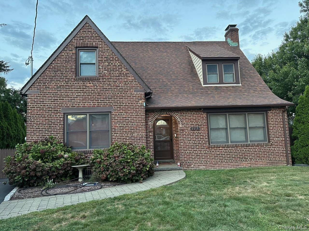 This beautiful home is a completely updated Brick Tudor on a Dead End street walking distance to schools, LIRR, shopping and more !