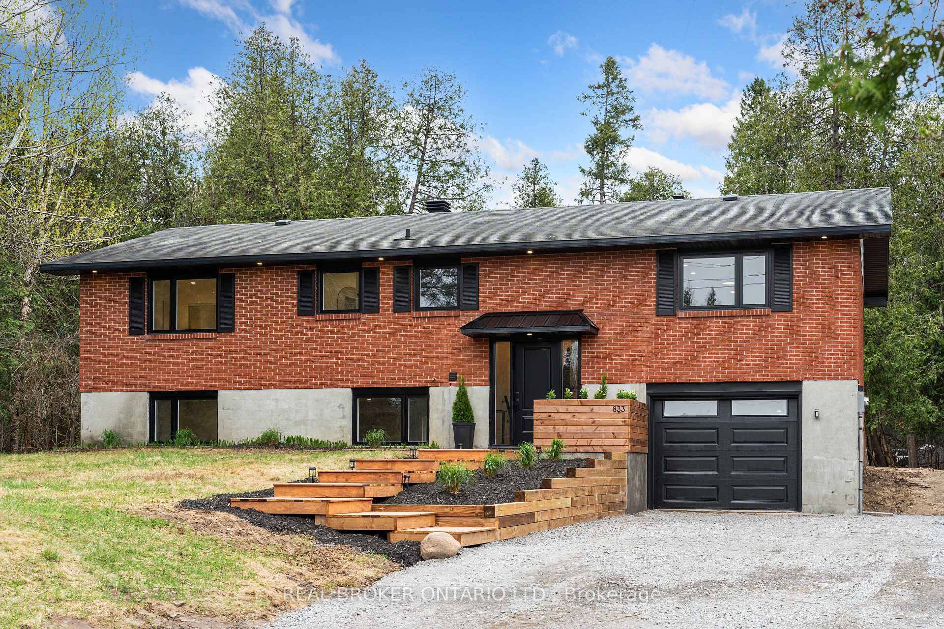 Welcome to this updated 5 bedroom split level brick home, tucked away on a private, treed 2.
