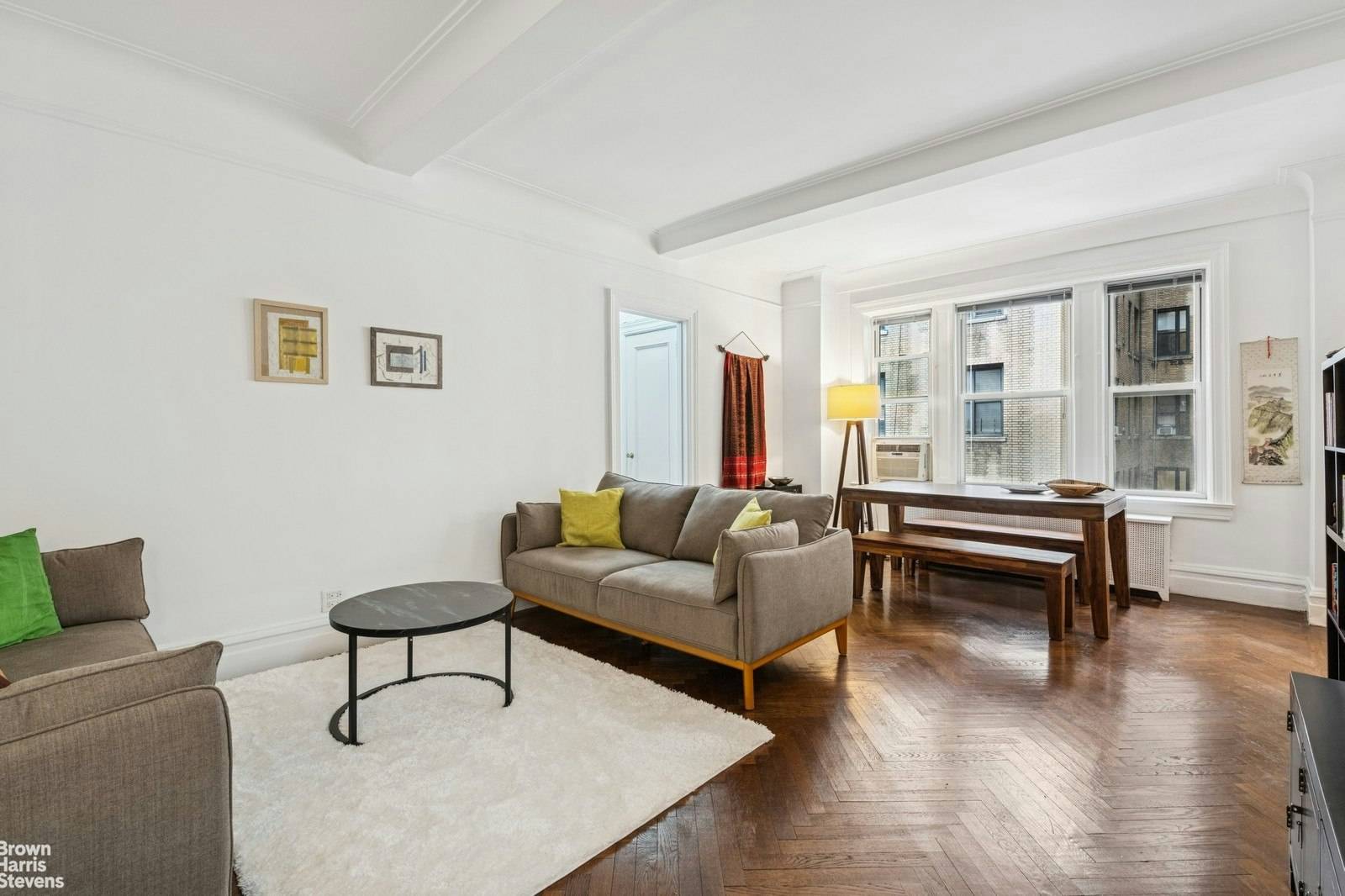 This beautiful prewar one bedroom is spacious, with high beamed ceilings and hardwood floors throughout.