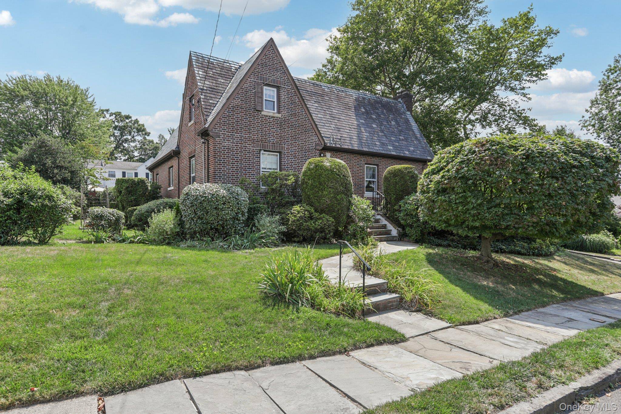 Nestled in the desirable Woodstock Park neighborhood of Yonkers, this classic brick English Tudor offers timeless character and room to grow.