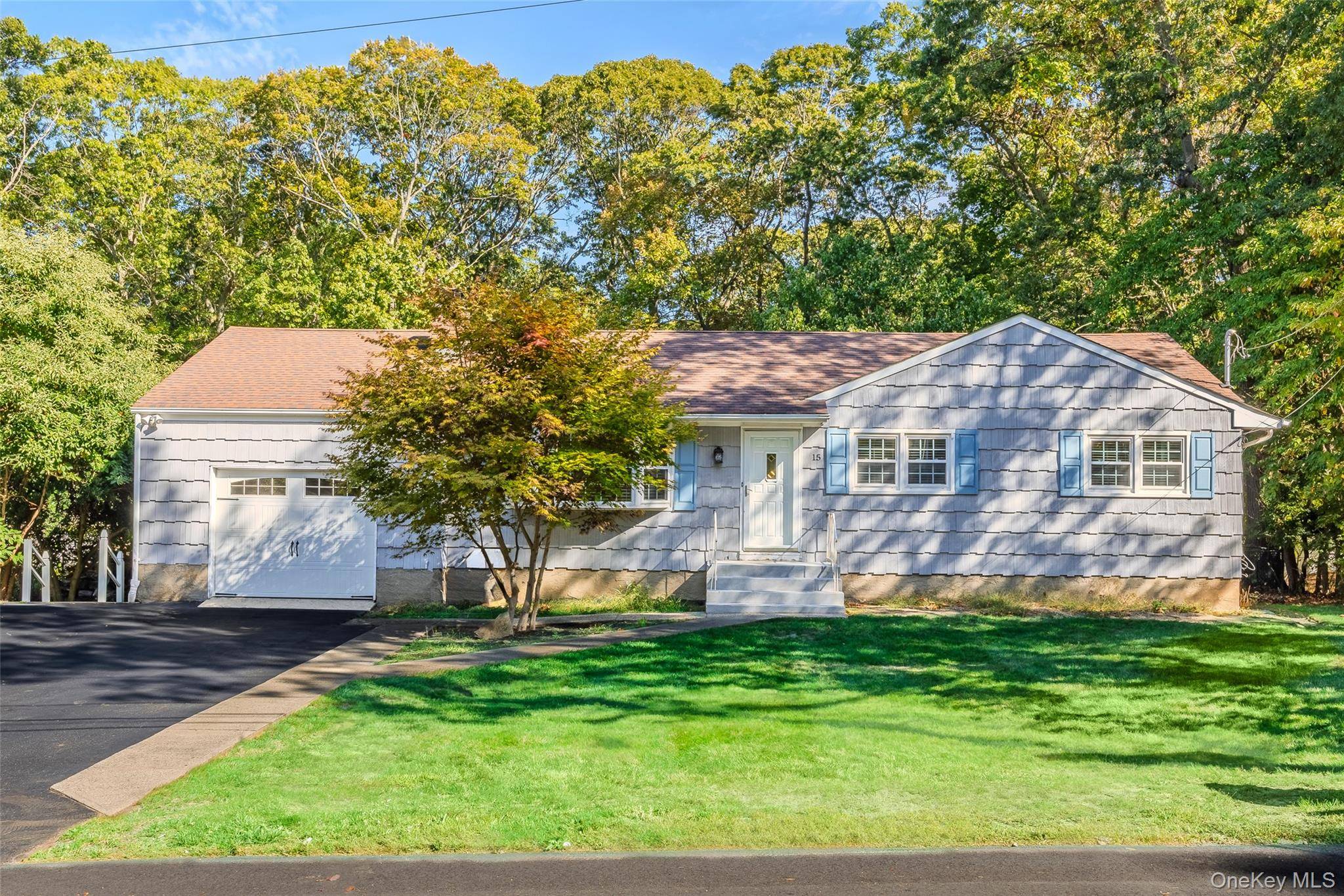 Spacious ranch North of 25A on almost 1 2 acre.