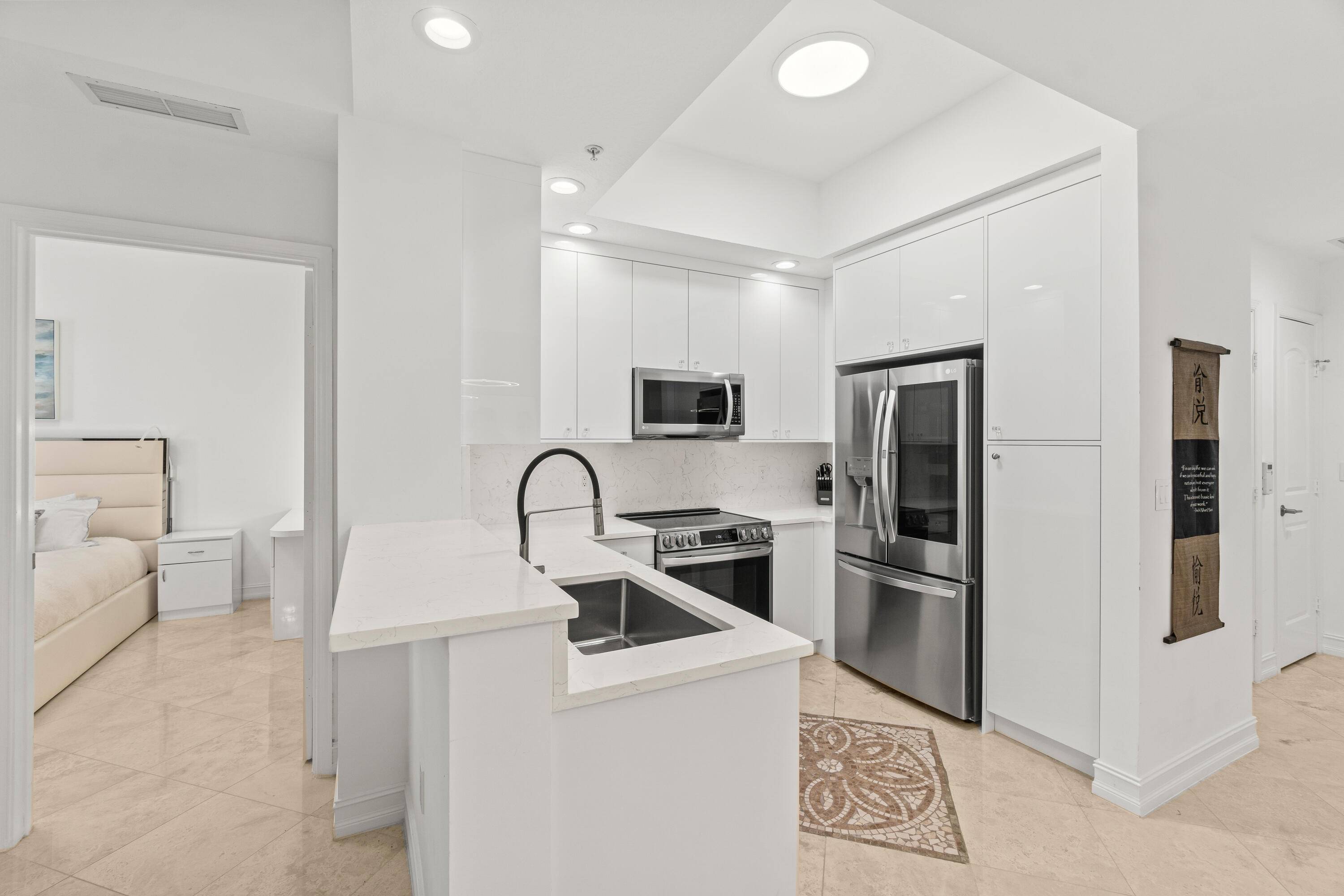 Experience luxury living in this modern 2 bedroom, 2 bath condo featuring an open concept design, high end finishes, and abundant natural light.