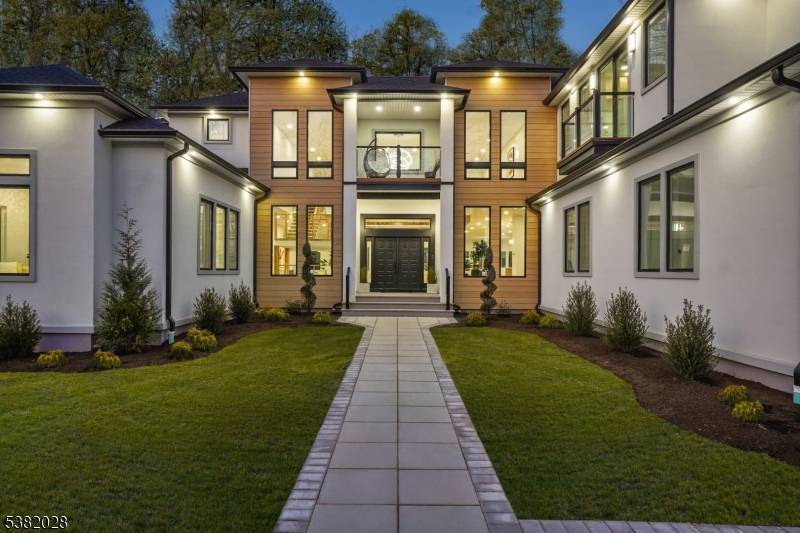 Nestled on almost an acre, this NEW and CUSTOM luxury estate is the epitome of luxury living.