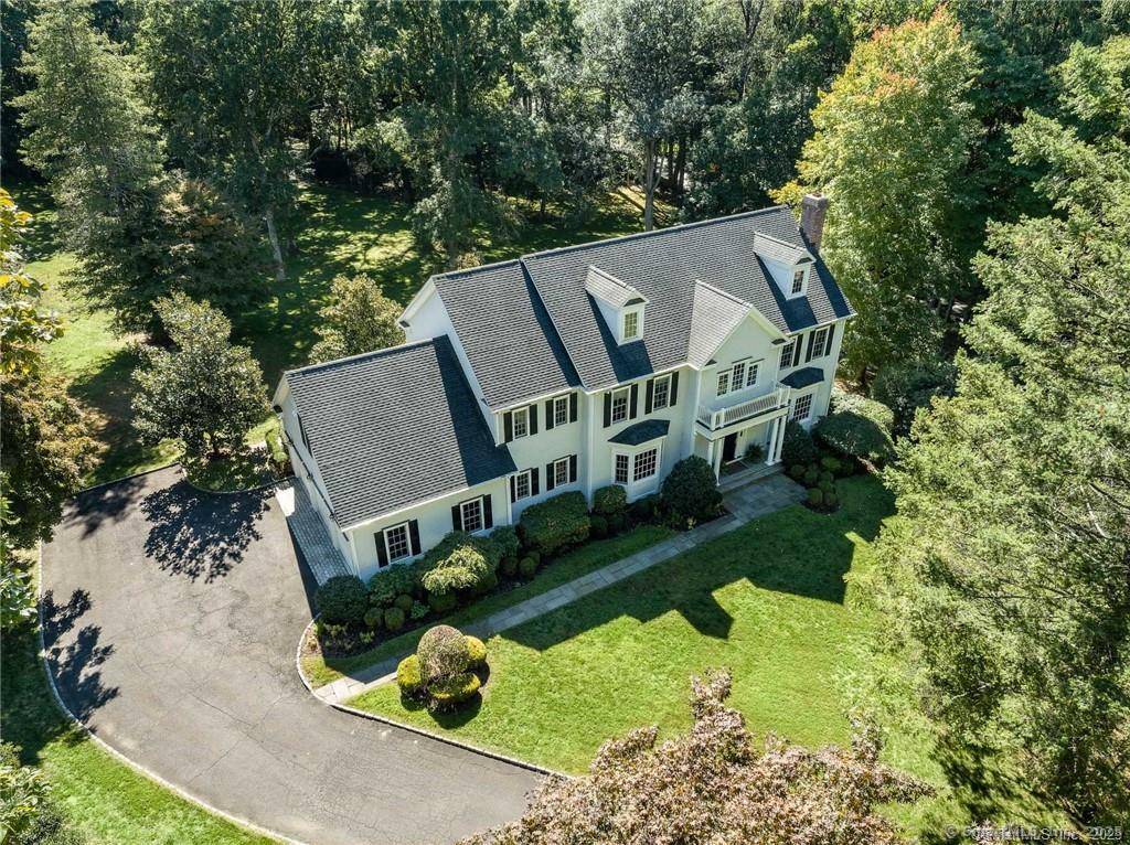 Perfectly situated on over two flat, beautifully usable acres, this exceptional 5 bedroom, 4 full 2 half bath home offers nearly 8, 000 square feet of living space across four ...