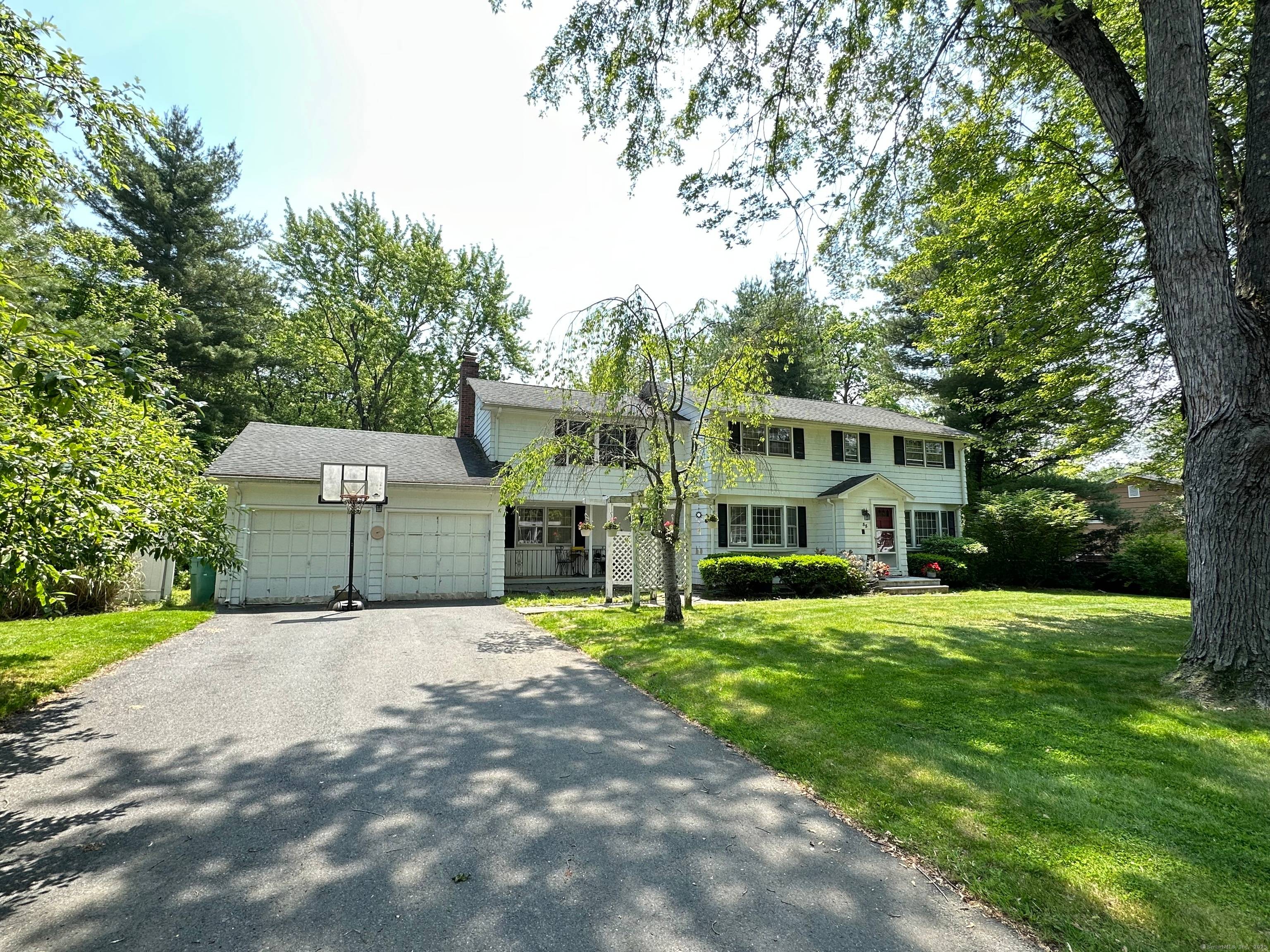 Set on a spacious lot with serene water views, this 4 bedroom, 2.