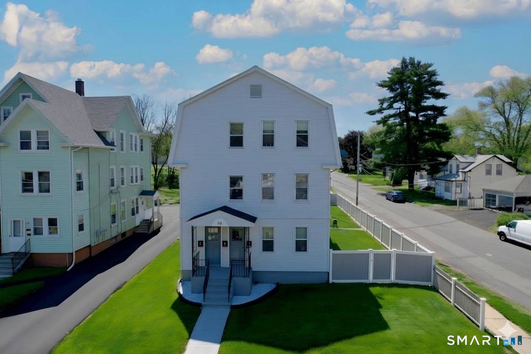 Beautifully Updated Meticulously Maintained Multifamily Home with Ample Parking and Garages.