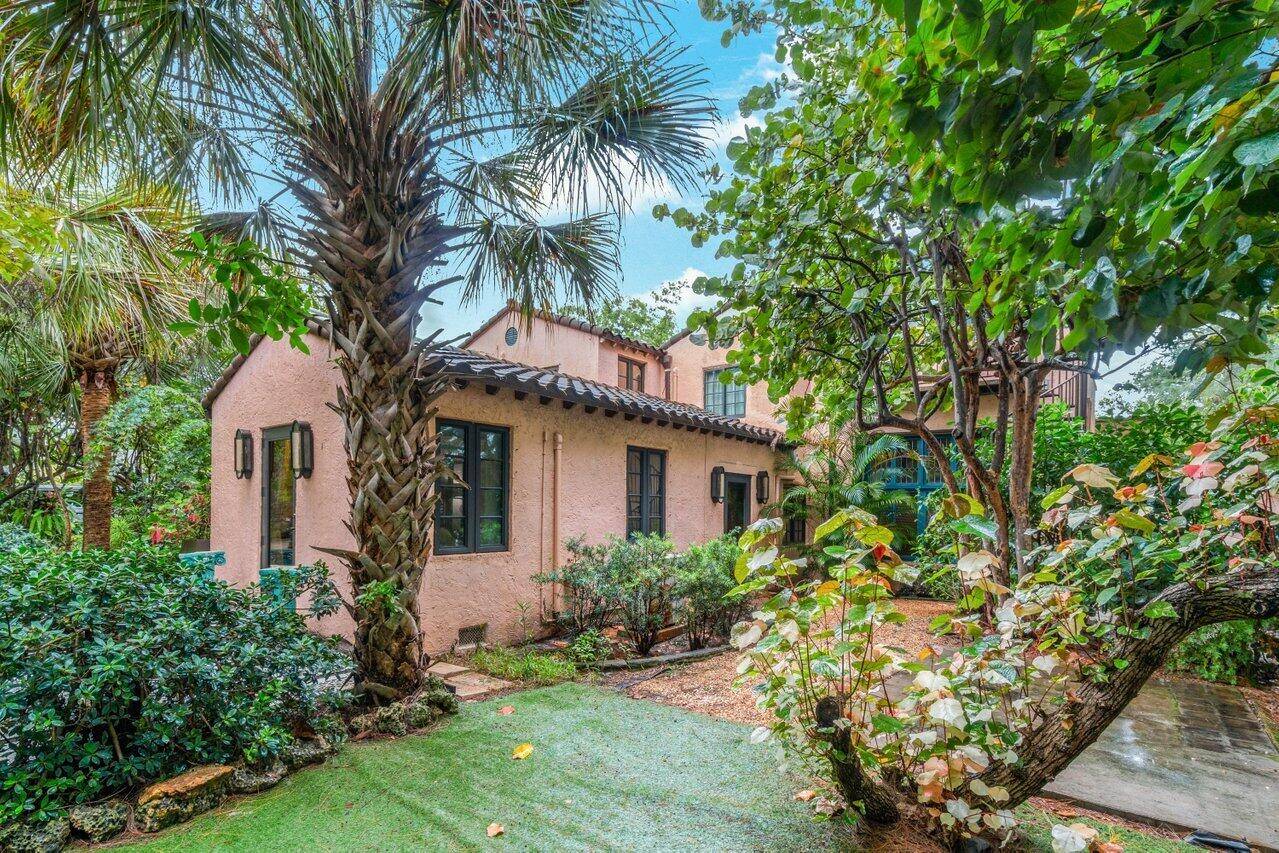 Step into the charm of this updated 1925 Spanish house with 4 Bedrooms, 3 baths, complete with a 3rd floor studio and pool on a private lushly landscaped walled estate ...
