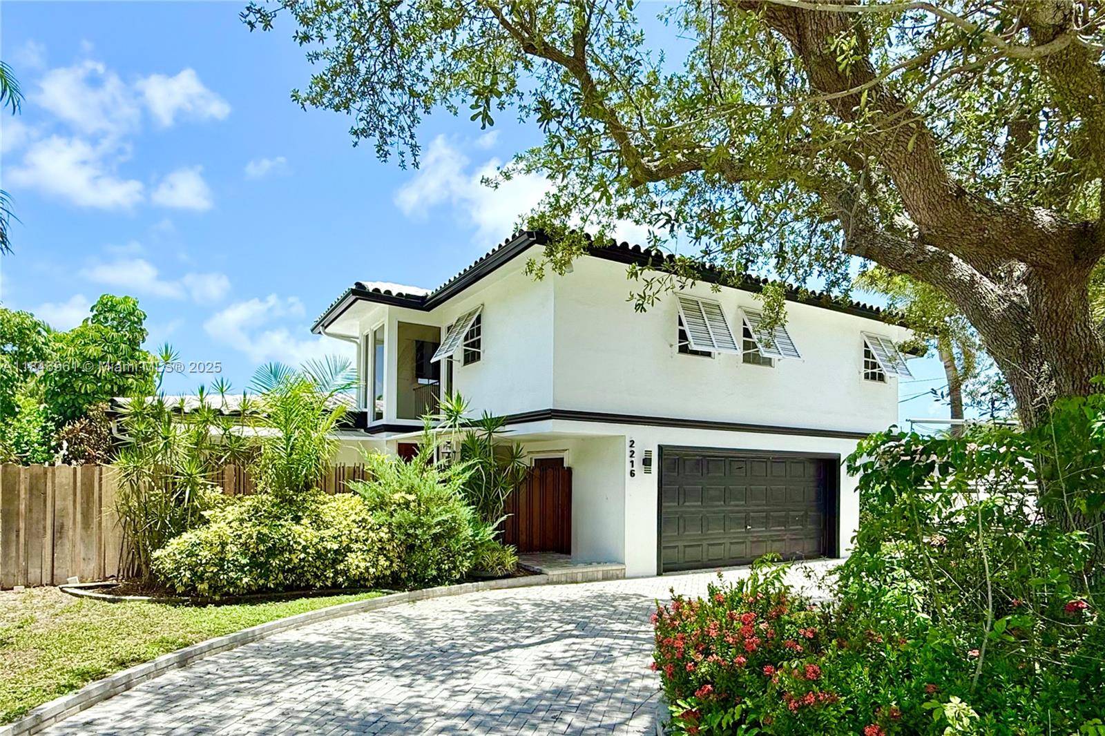 Magnificently remodeled 5 bedroom waterfront home with OCEAN ACESSS and a two car garage.