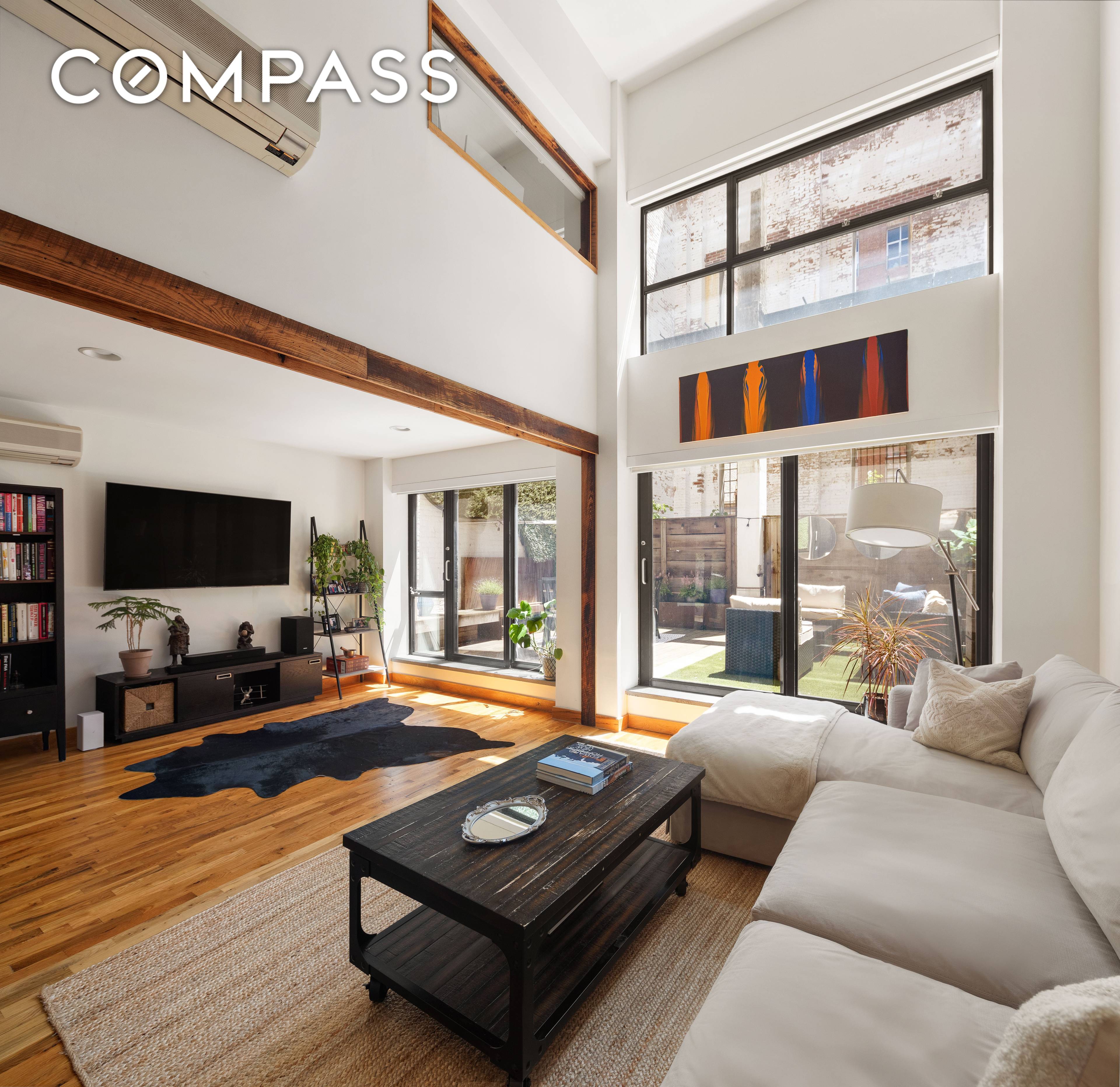 Your own private outdoor space, soaring ceilings and industrial chic finishes welcome you home in this stunning two bedroom, two bath Dumbo triplex loft.