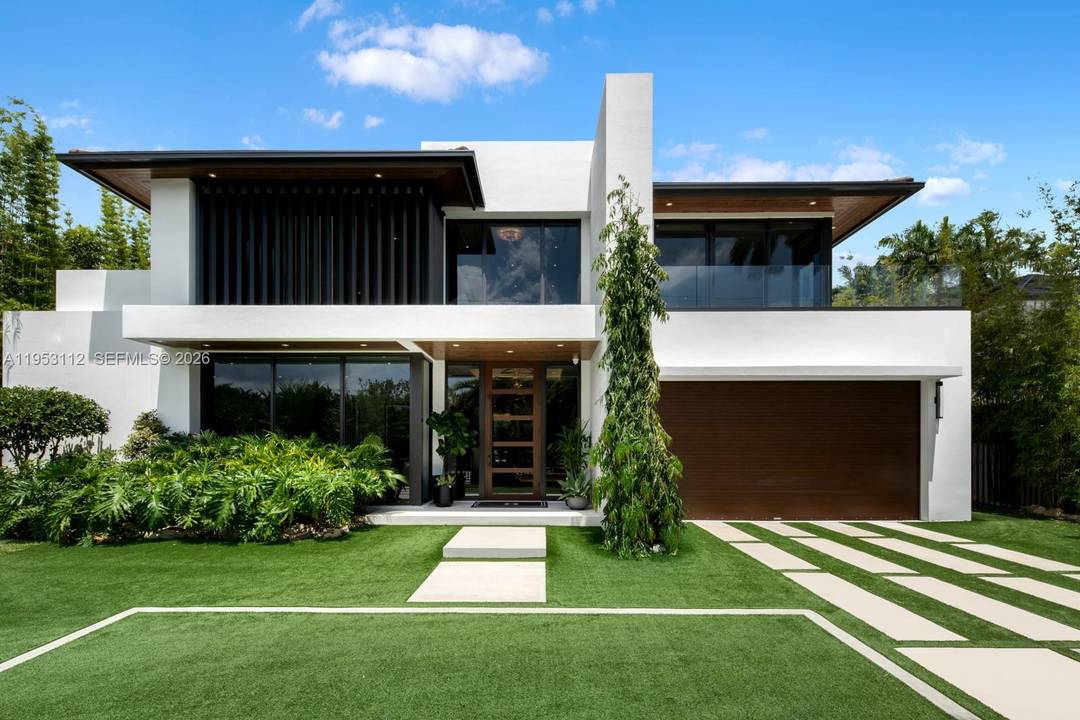 Architectural contemporary estate in the North of Pinecrest, completed in 2023 and set on an expansive canal front lot offering more living area than shown on the tax roll.