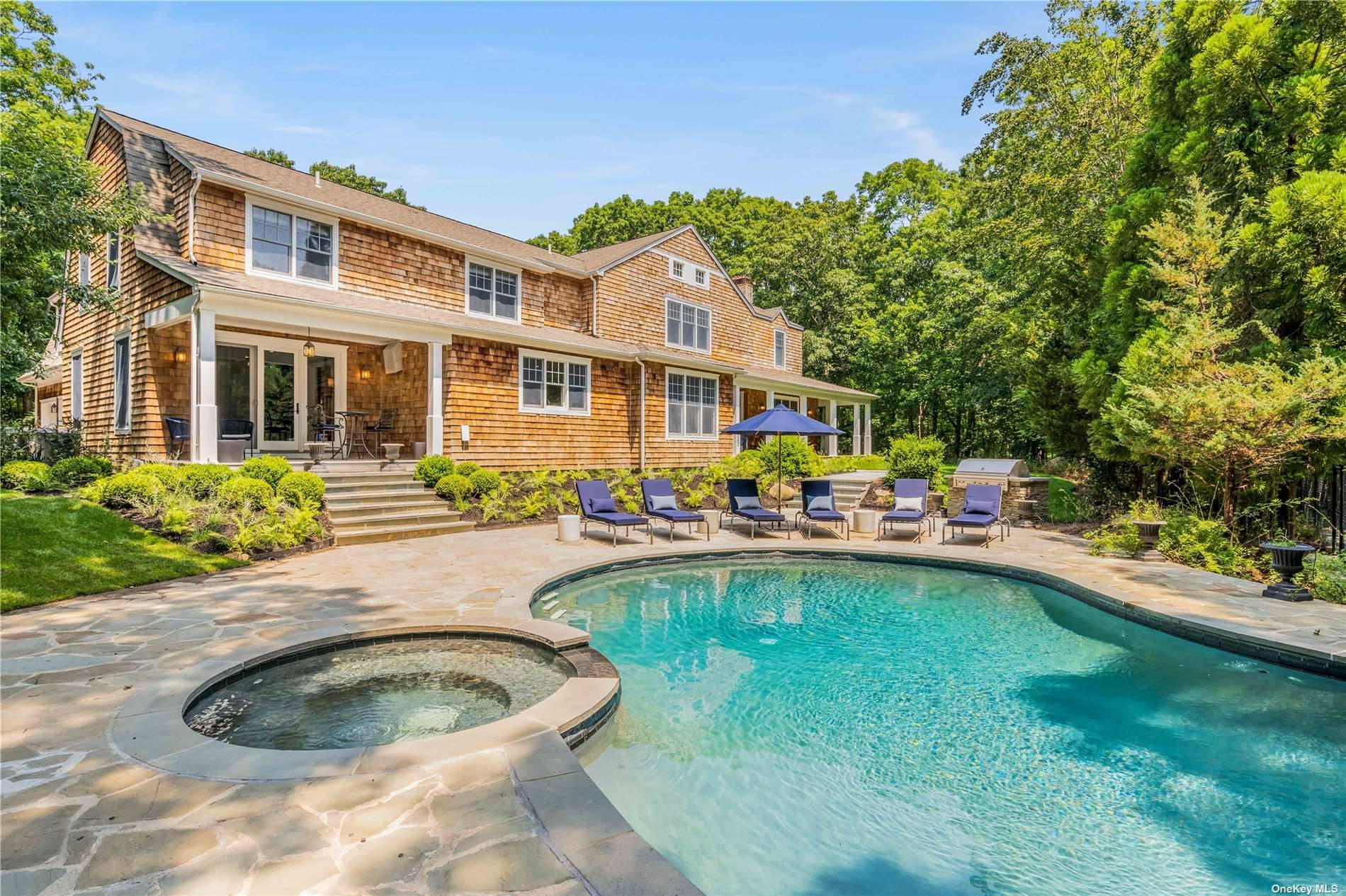 Available Summer 2022 ! Situated on nearly six acres of lush green forest, this seven bedroom, seven bathroom estate offers the perfect summer retreat.