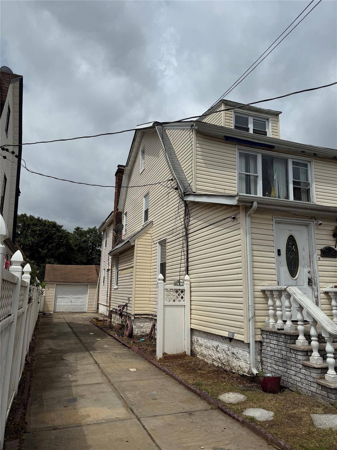Welcome to 119 42 189th Street a well maintained 2 family home offering excellent income potential.