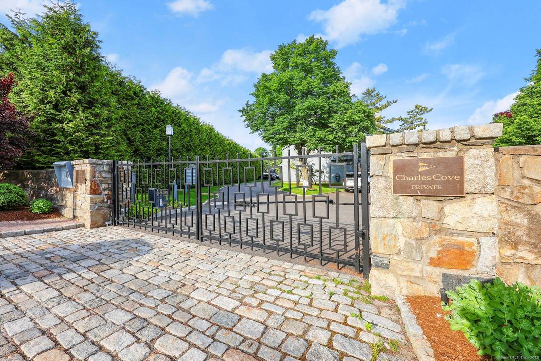 Experience true waterfront living at Charles Cove, one of the area's most sought after gated communities with pool, tennis, scenic boardwalk, and direct water access.